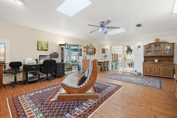 a view of a dining room with furniture and wooden floor