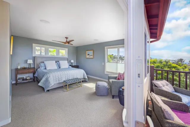 a bedroom with a bed and a couch