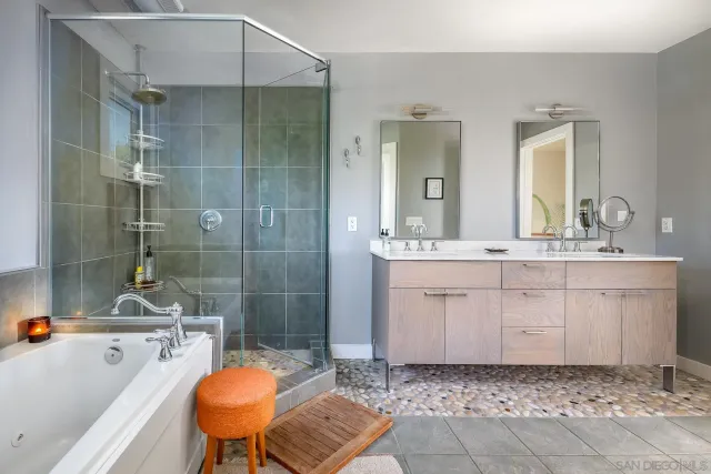 a bathroom with a sink a toilet a mirror and bathtub