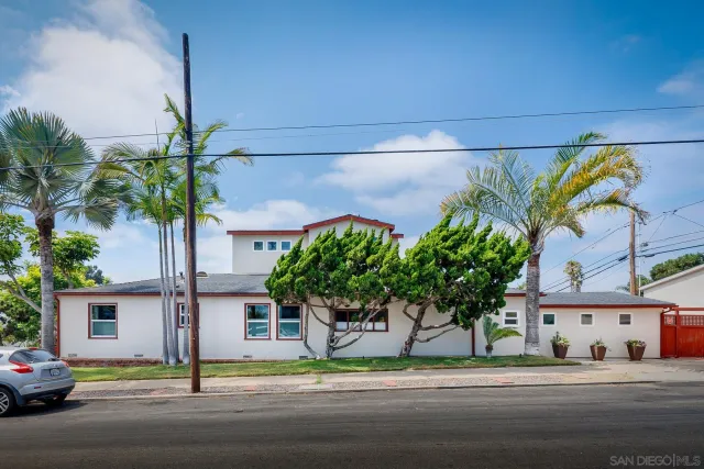 a white building with a street