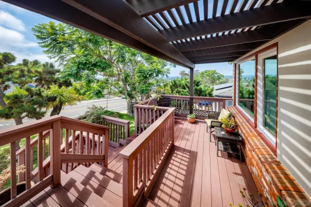 a view of balcony with furniture