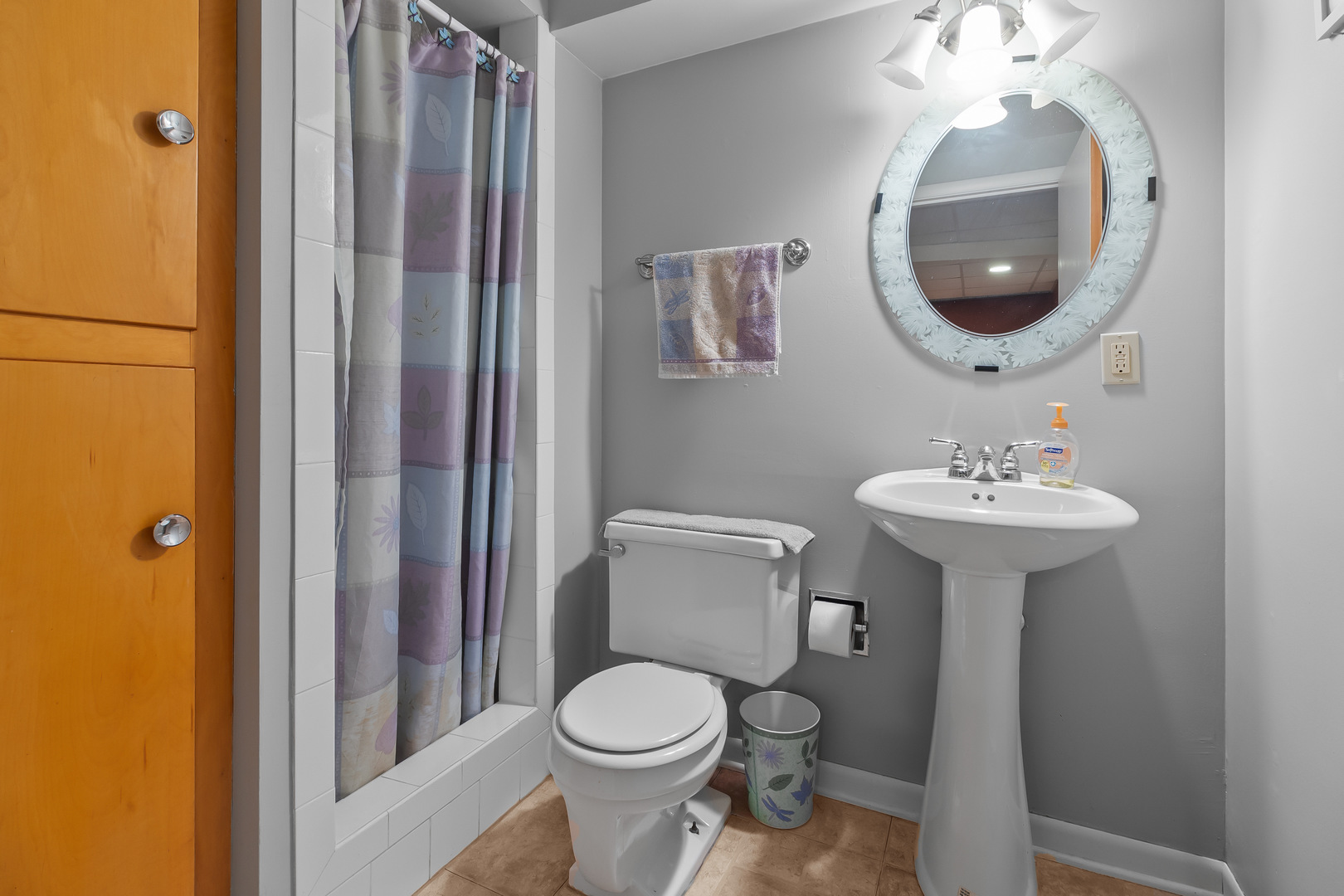 1306 Garfield Road Harvard, IL 60033 - Photo 26 of 38 a bathroom with a toilet a sink and mirror