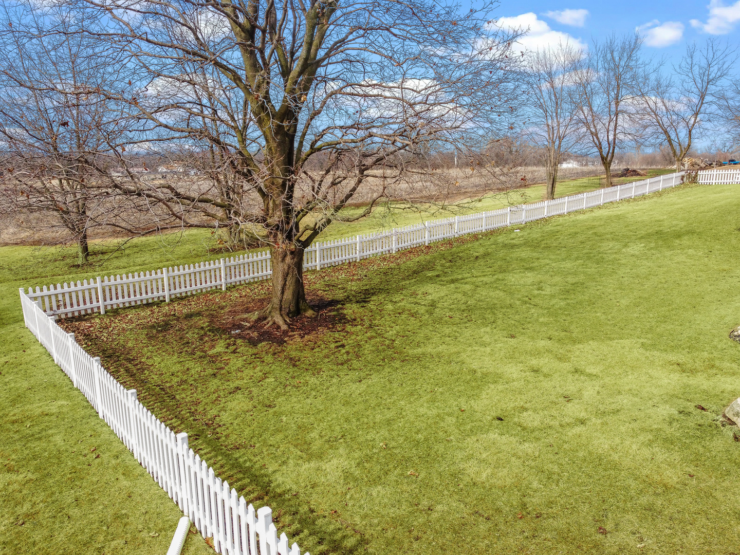 1306 Garfield Road Harvard, IL 60033 - Photo 36 of 38 a view of a yard with wooden fence