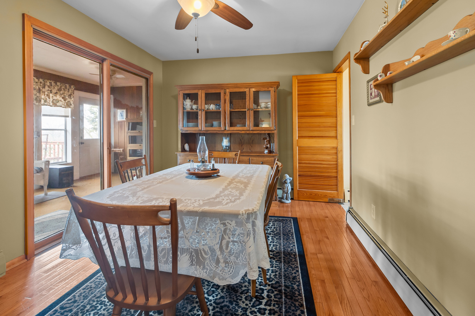 1306 Garfield Road Harvard, IL 60033 - Photo 6 of 38 a dining room with furniture window and wooden floor
