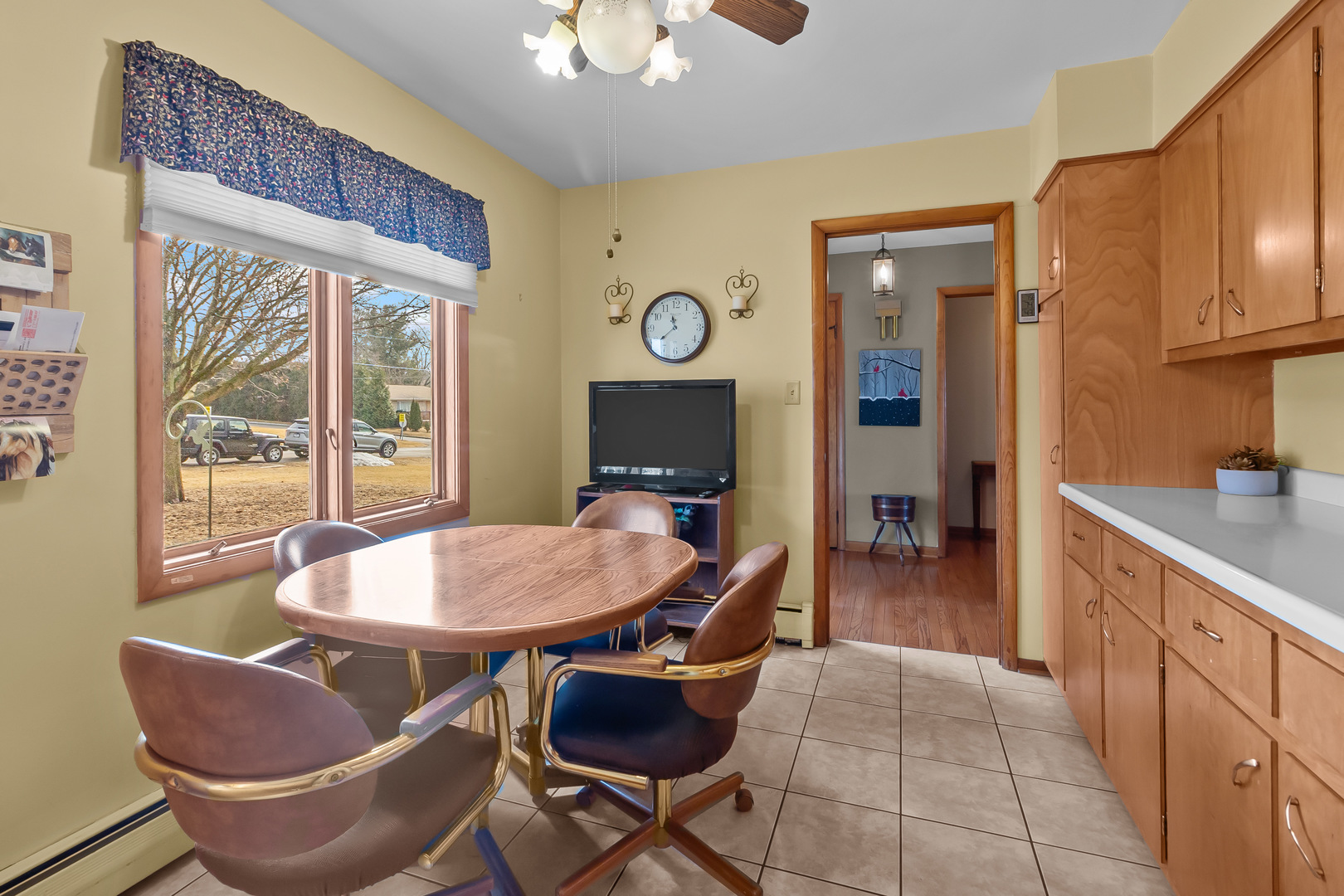 1306 Garfield Road Harvard, IL 60033 - Photo 9 of 38 a dining room with furniture and a floor to ceiling window