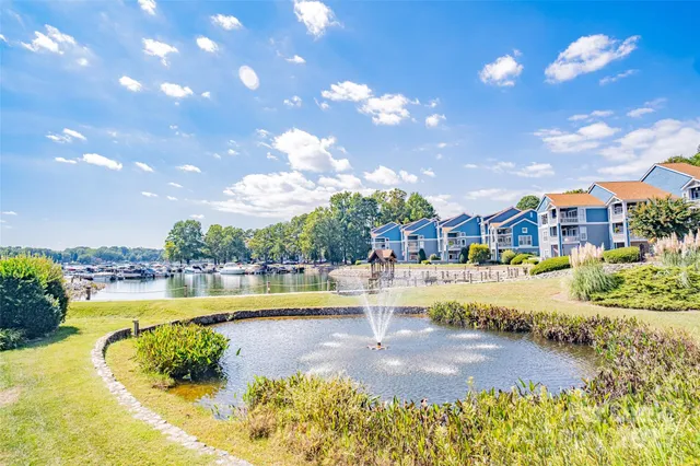 a swimming pool with outdoor seating and yard