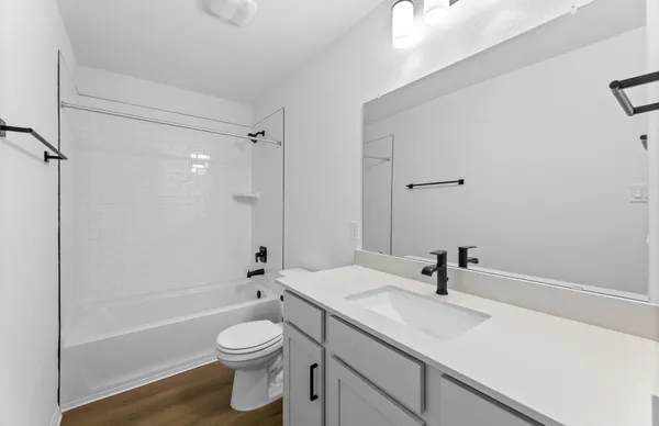 a view of small space with racks on the wall and a window