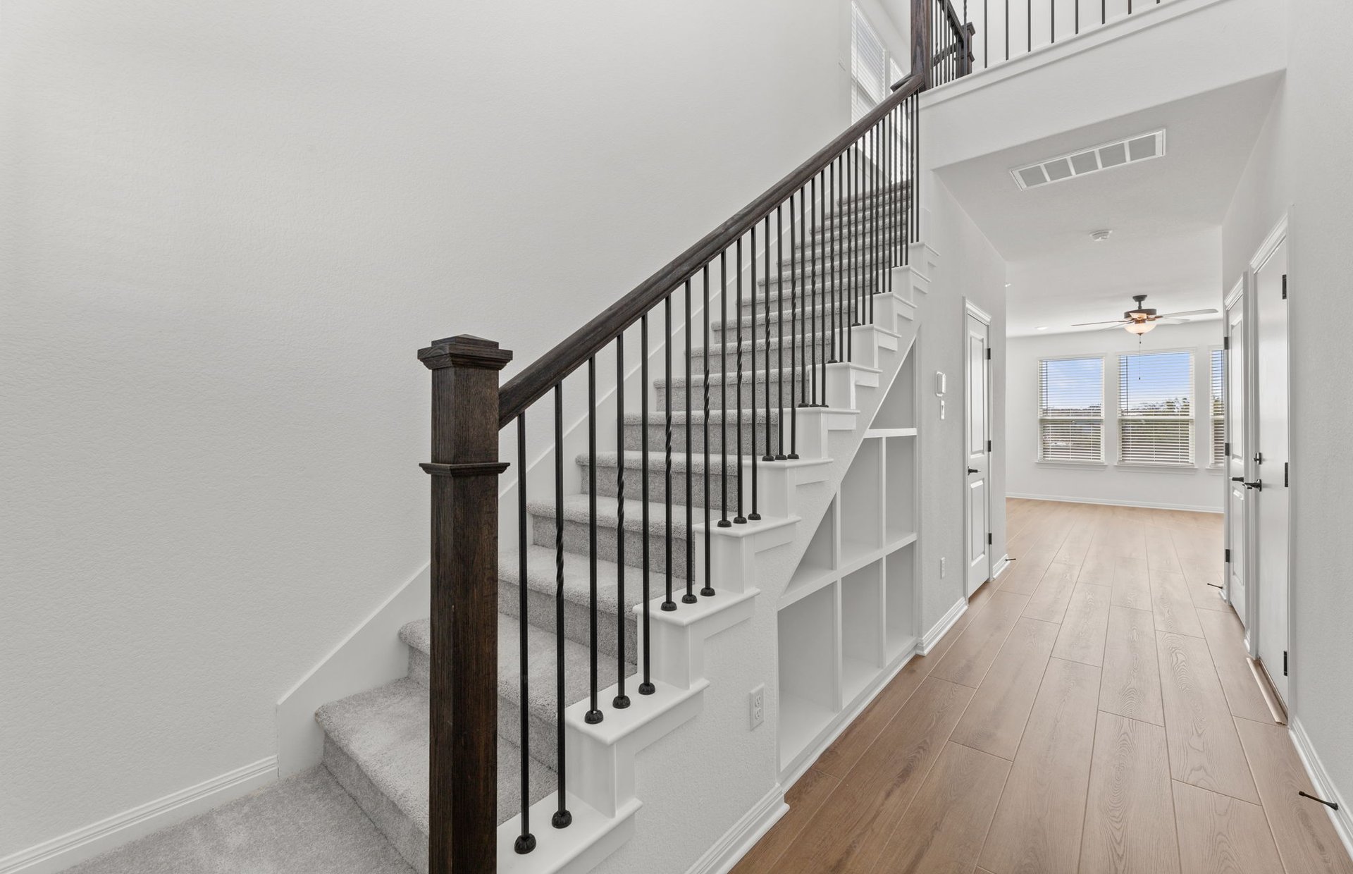 528 Knot Drive Leander, TX 78641 - Photo 14 of 29 a view of staircase with wooden floor and white walls
