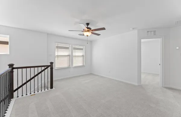 a view of workspace with furniture and windows