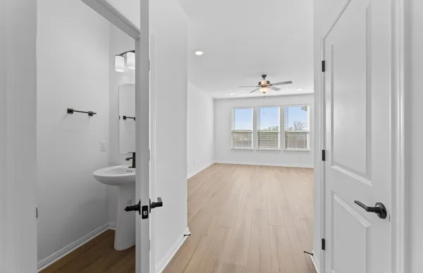 wooden floor in an empty room with a window