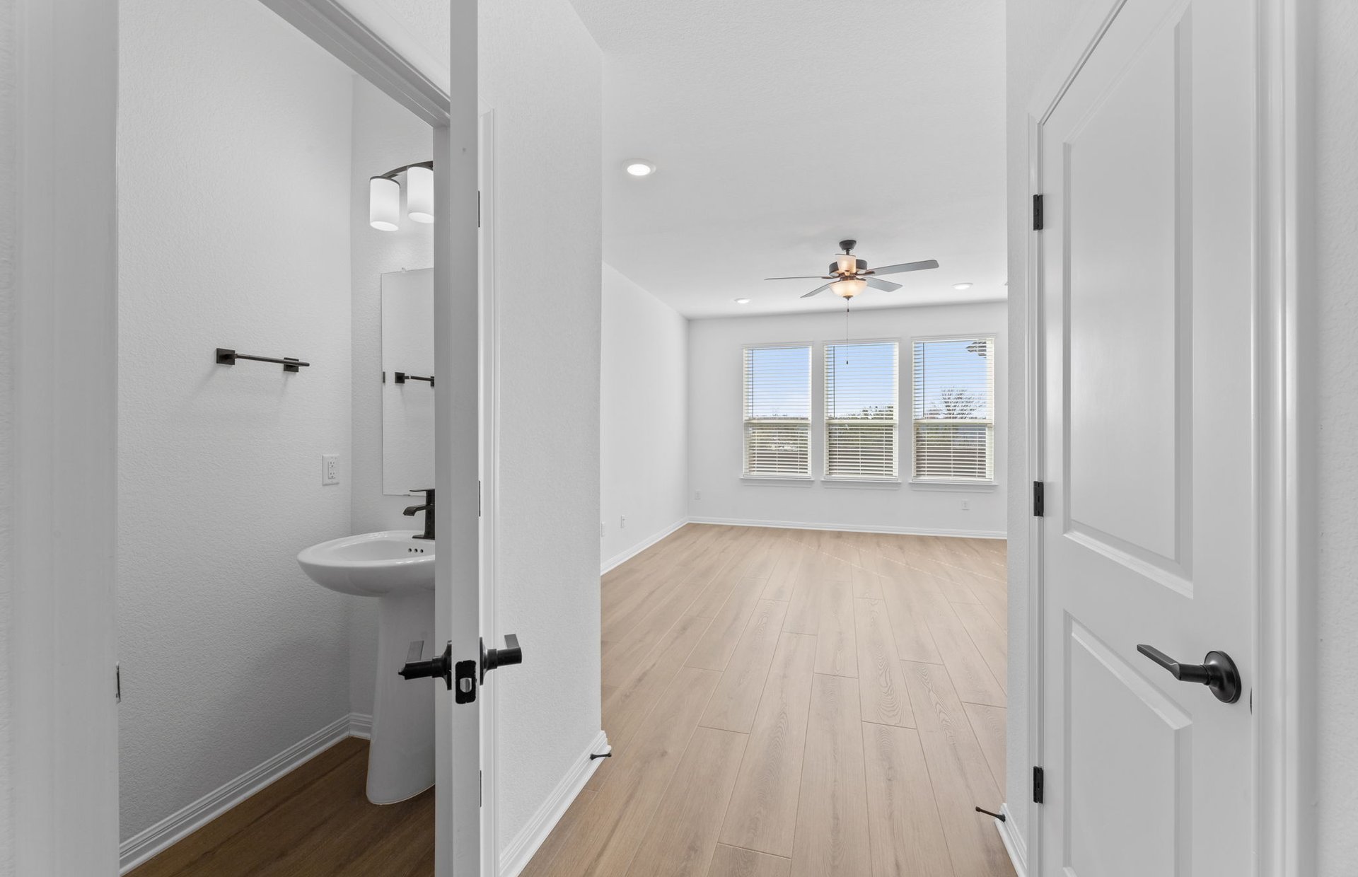 528 Knot Drive Leander, TX 78641 - Photo 18 of 29 wooden floor in an empty room with a window