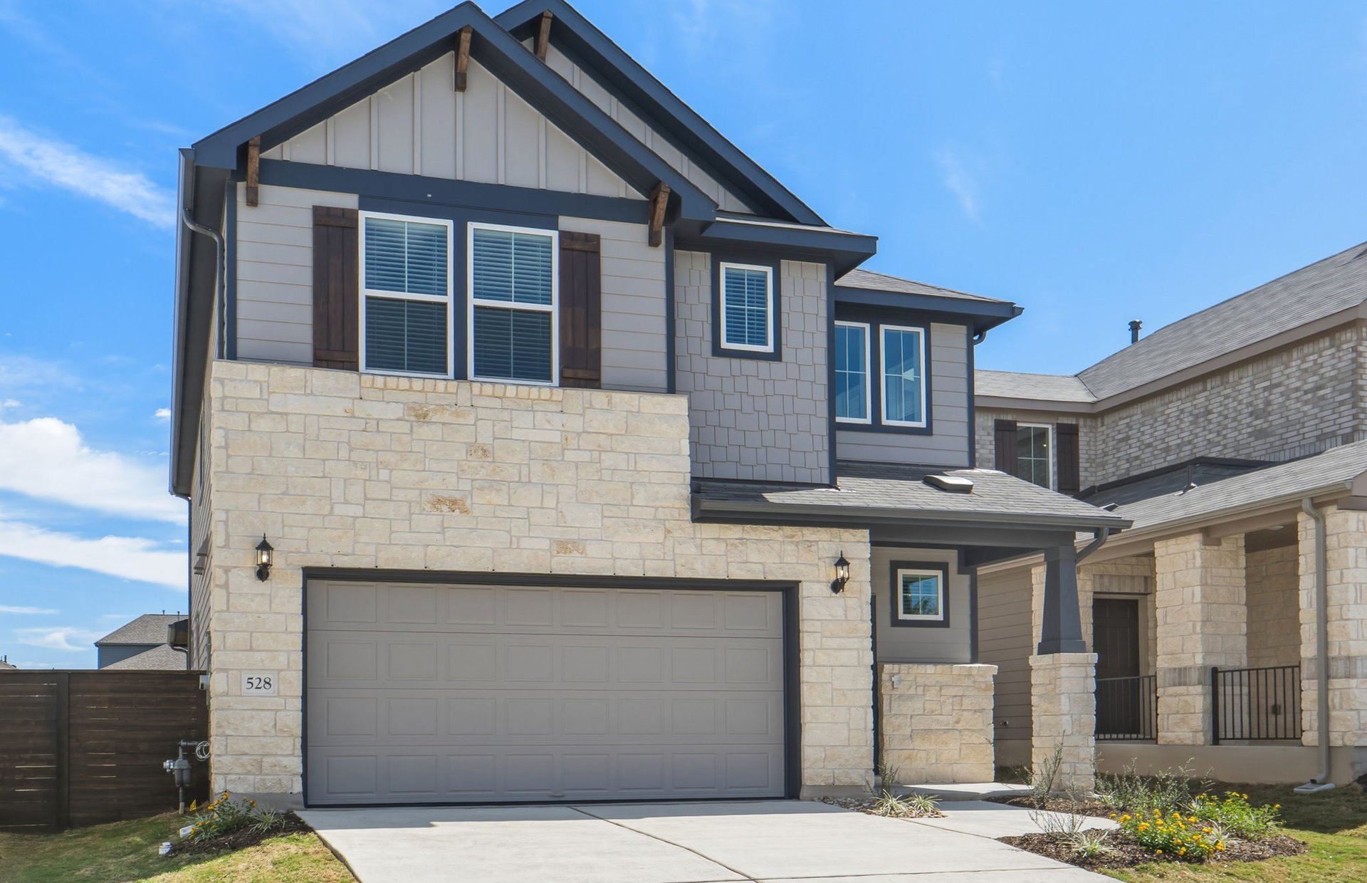 528 Knot Drive Leander, TX 78641 - Photo 2 of 29 a front view of a house with a garden