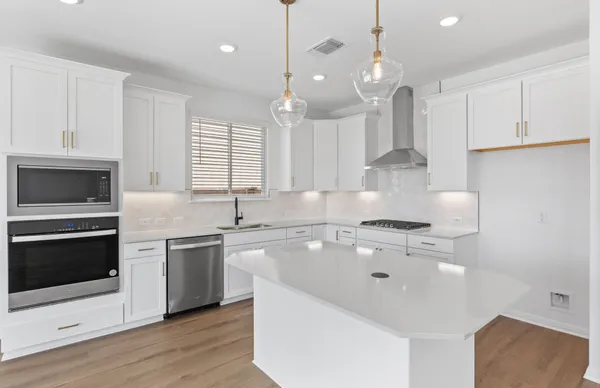 a view of kitchen with wooden floor and window