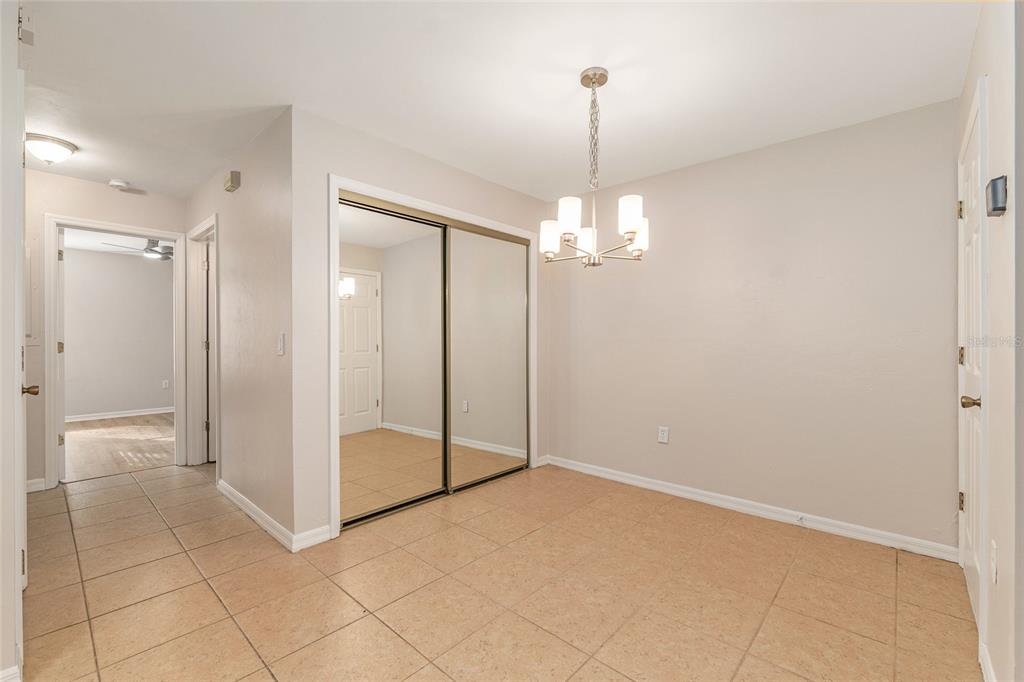 9755 Southwest 52nd Road Gainesville, FL 32608 - Photo 16 of 43 a view of a chandelier in big room and chandelier fan
