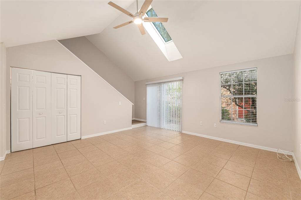 9755 Southwest 52nd Road Gainesville, FL 32608 - Photo 20 of 43 an empty room with windows and fan