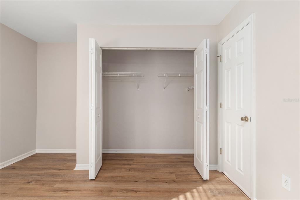 9755 Southwest 52nd Road Gainesville, FL 32608 - Photo 36 of 43 a view of an empty room with wooden floor