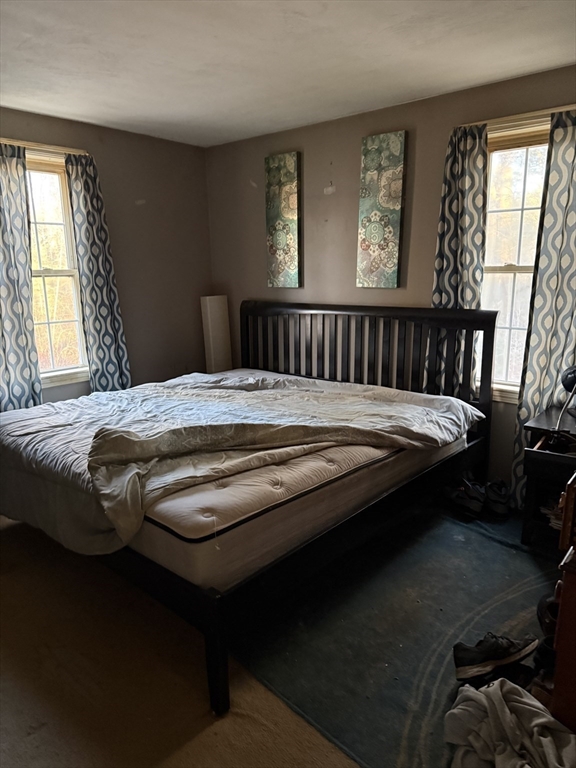 6 Rumford Road Norton, MA 02766 - Photo 7 of 10 a bed sitting in a bedroom next to a window