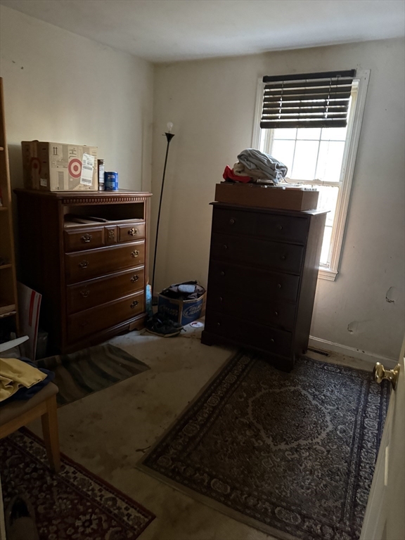 6 Rumford Road Norton, MA 02766 - Photo 8 of 10 a living room with furniture and a fireplace