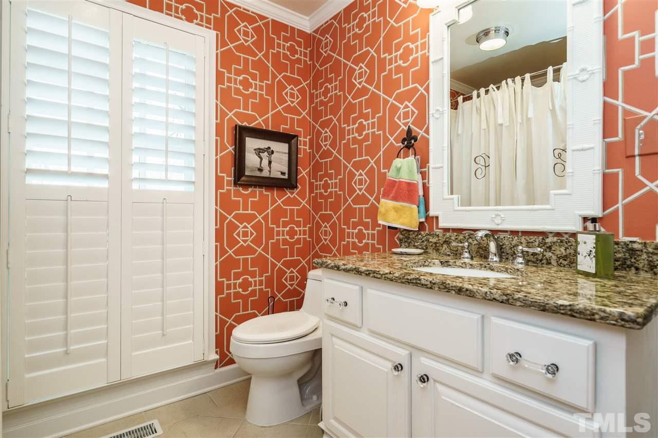 7116 North Ridge Drive Raleigh, NC 27615 - Photo 14 of 25 a bathroom with a granite countertop toilet sink and mirror