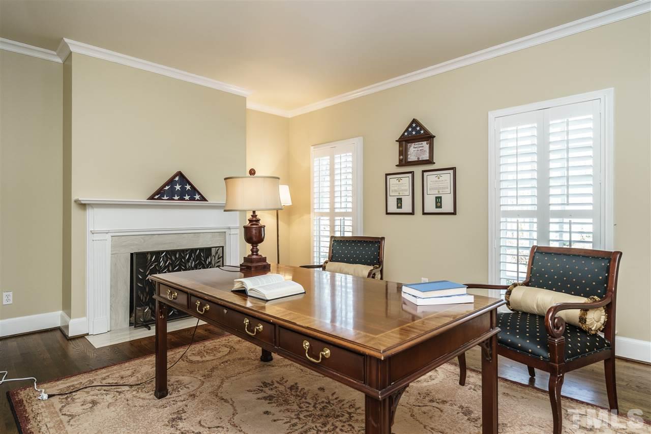 7116 North Ridge Drive Raleigh, NC 27615 - Photo 4 of 25 a view of a livingroom with furniture and a fireplace