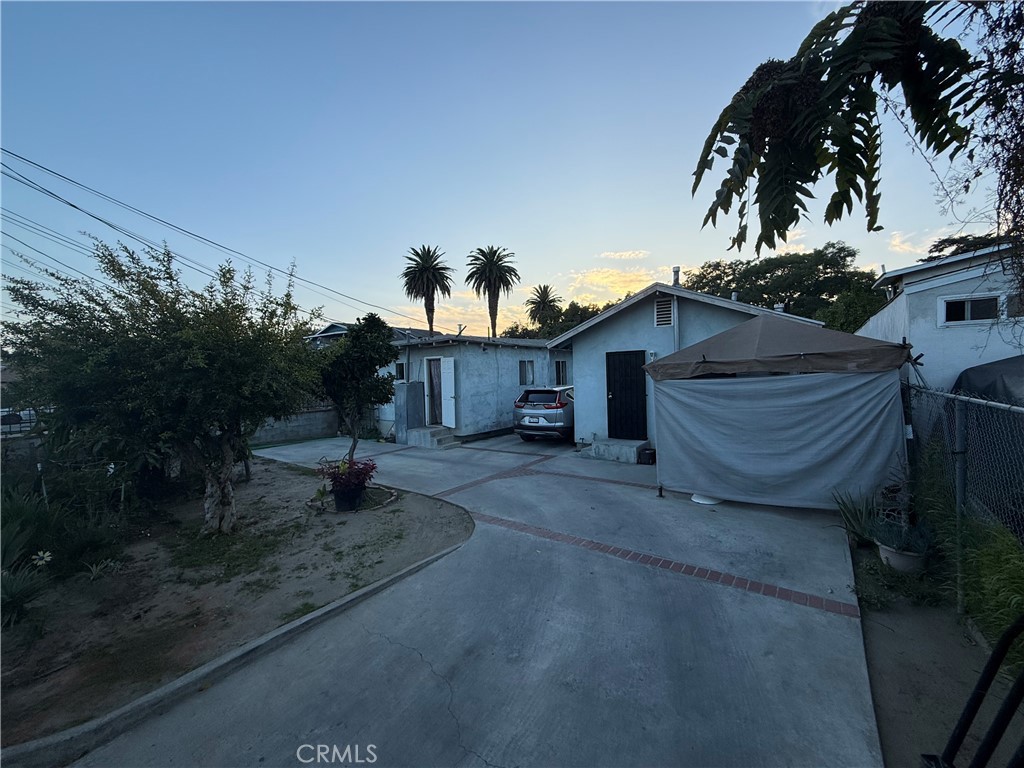 4020 Trinity Street Los Angeles, CA 90011 - Photo 12 of 22 a view of a house with a yard