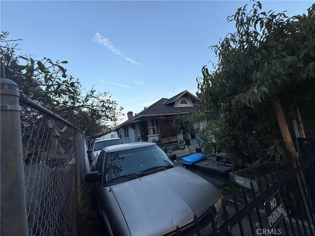 a front view of a house with parking space