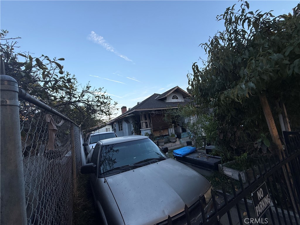 4020 Trinity Street Los Angeles, CA 90011 - Photo 17 of 22 a patio with table and chairs and potted plants
