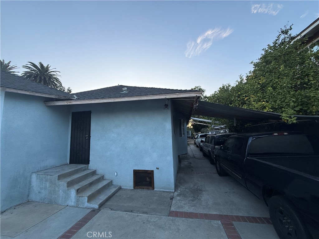 4020 Trinity Street Los Angeles, CA 90011 - Photo 19 of 22 a front view of a house with parking space