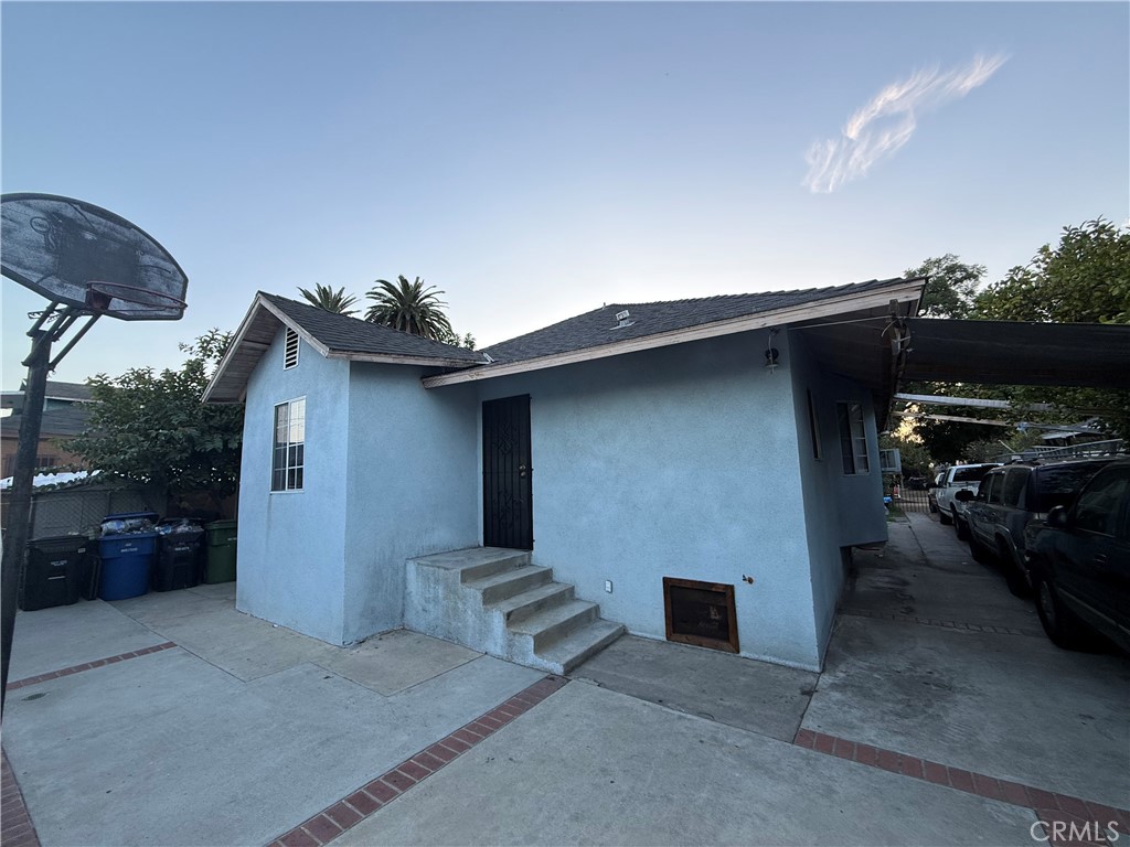 4020 Trinity Street Los Angeles, CA 90011 - Photo 4 of 22 a house view with a backyard space