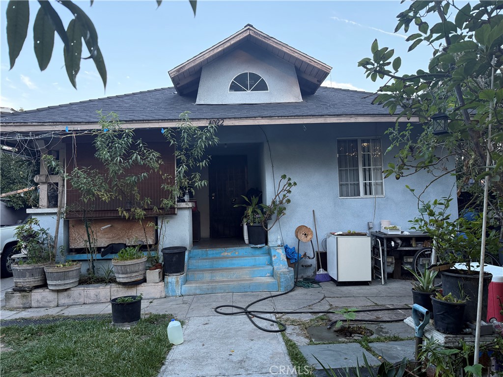 4020 Trinity Street Los Angeles, CA 90011 - Photo 7 of 22 a view of a house with a patio