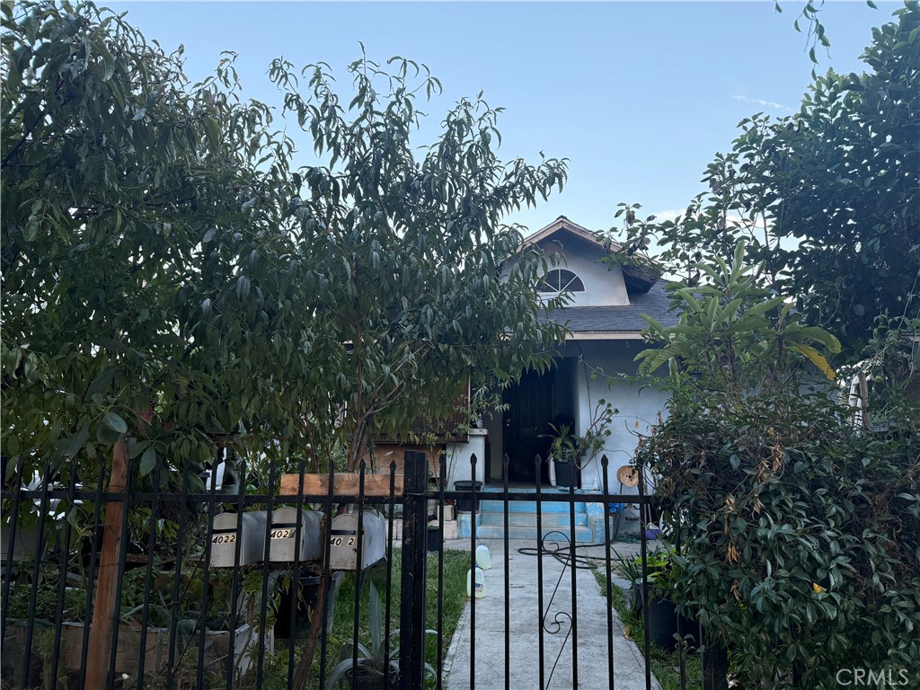 4020 Trinity Street Los Angeles, CA 90011 - Photo 8 of 22 a view of a house with a flower garden