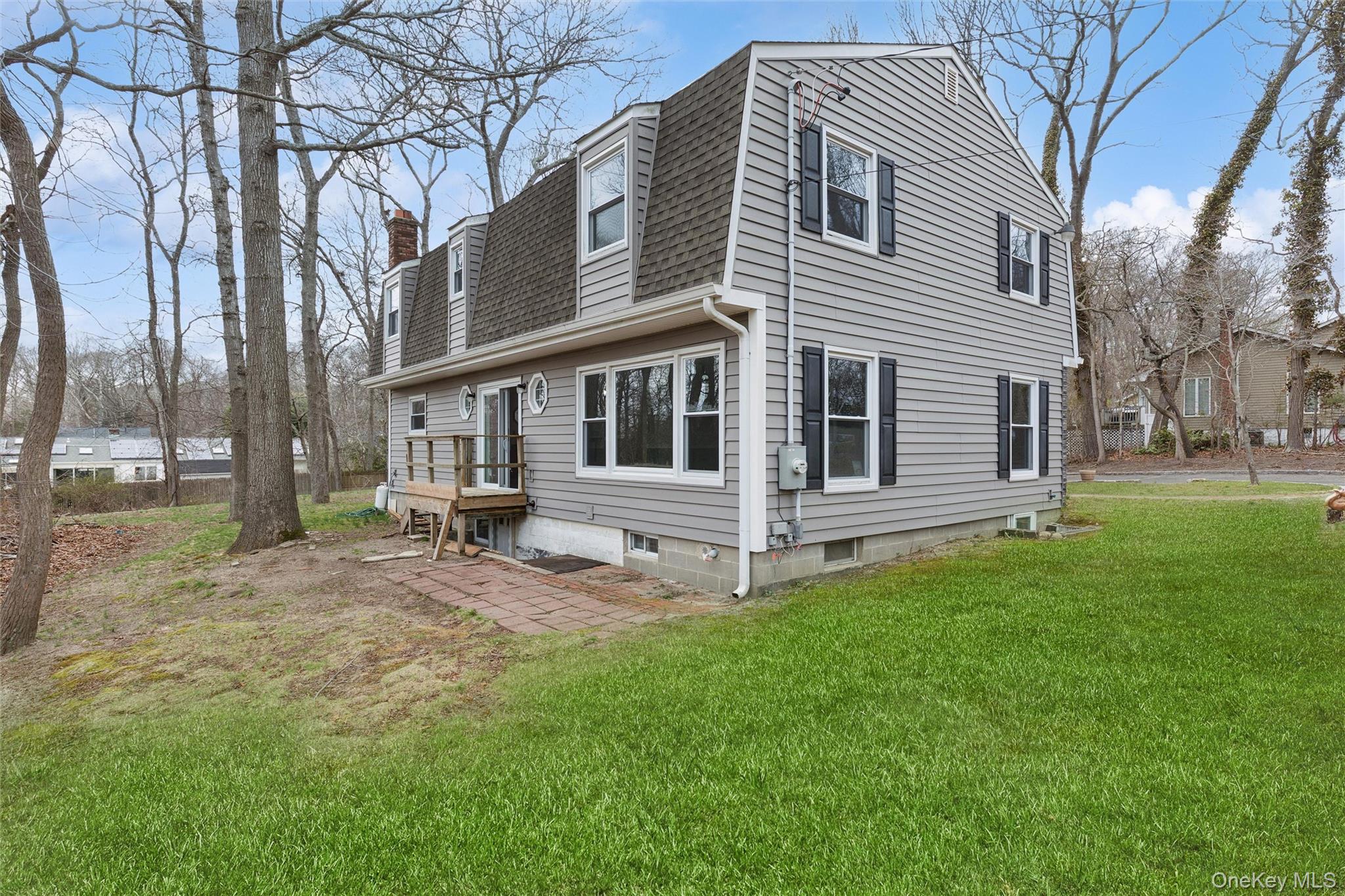 49 Overhill Road Wading River, NY 11792 - Photo 23 of 27 a view of a house with a yard