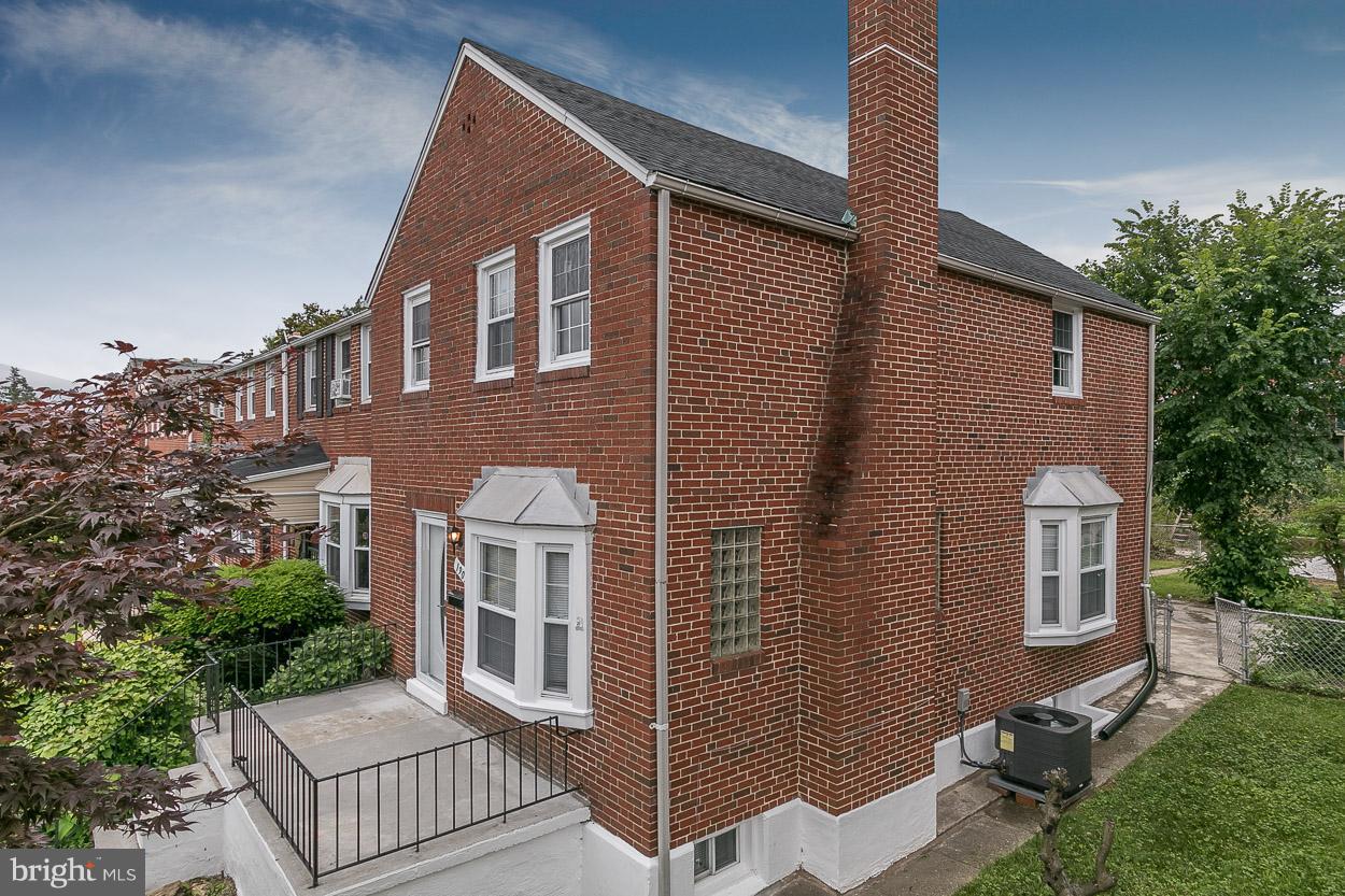 1901 Crestview Road Baltimore, MD 21239 - Photo 2 of 30 a front view of a house with a yard