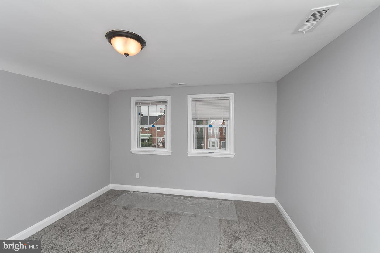 1901 Crestview Road Baltimore, MD 21239 - Photo 14 of 30 an empty room with windows