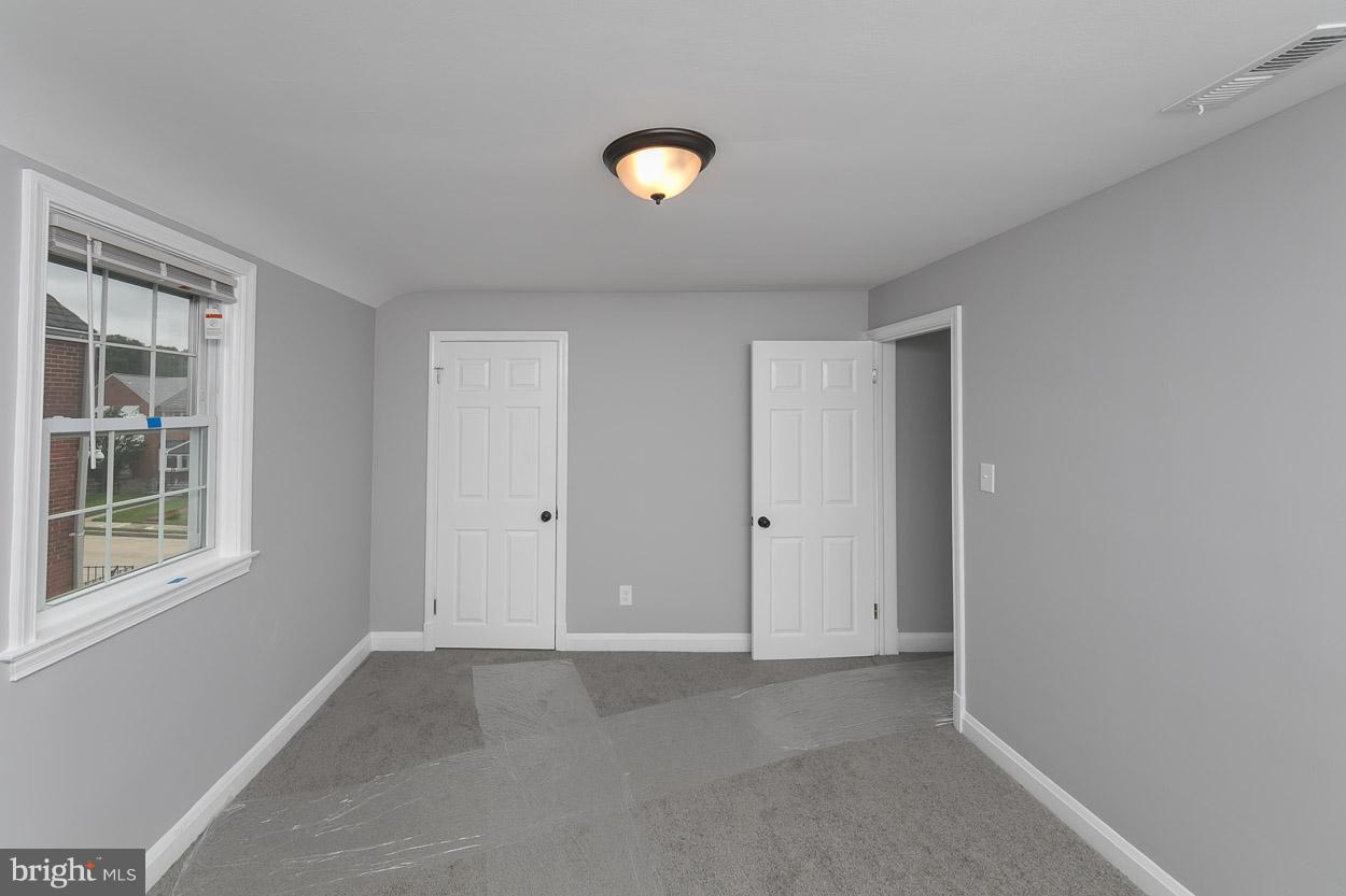 1901 Crestview Road Baltimore, MD 21239 - Photo 19 of 30 a view of an empty room with a window