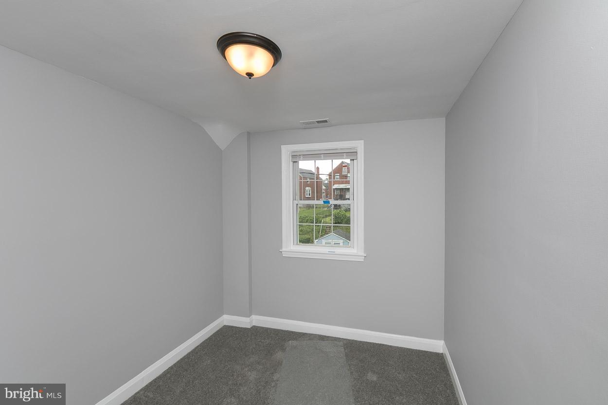 1901 Crestview Road Baltimore, MD 21239 - Photo 20 of 30 an empty room with a window
