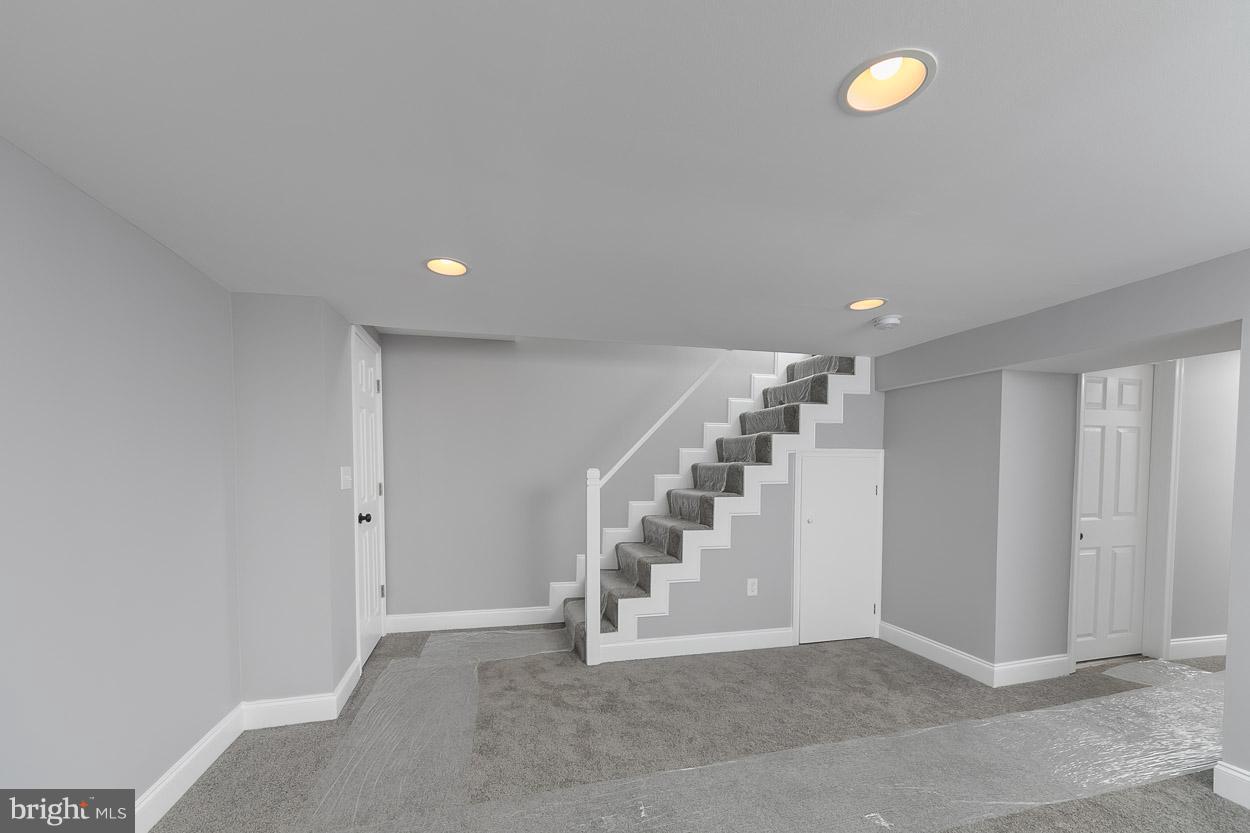 1901 Crestview Road Baltimore, MD 21239 - Photo 22 of 30 a view of an empty room with stairs