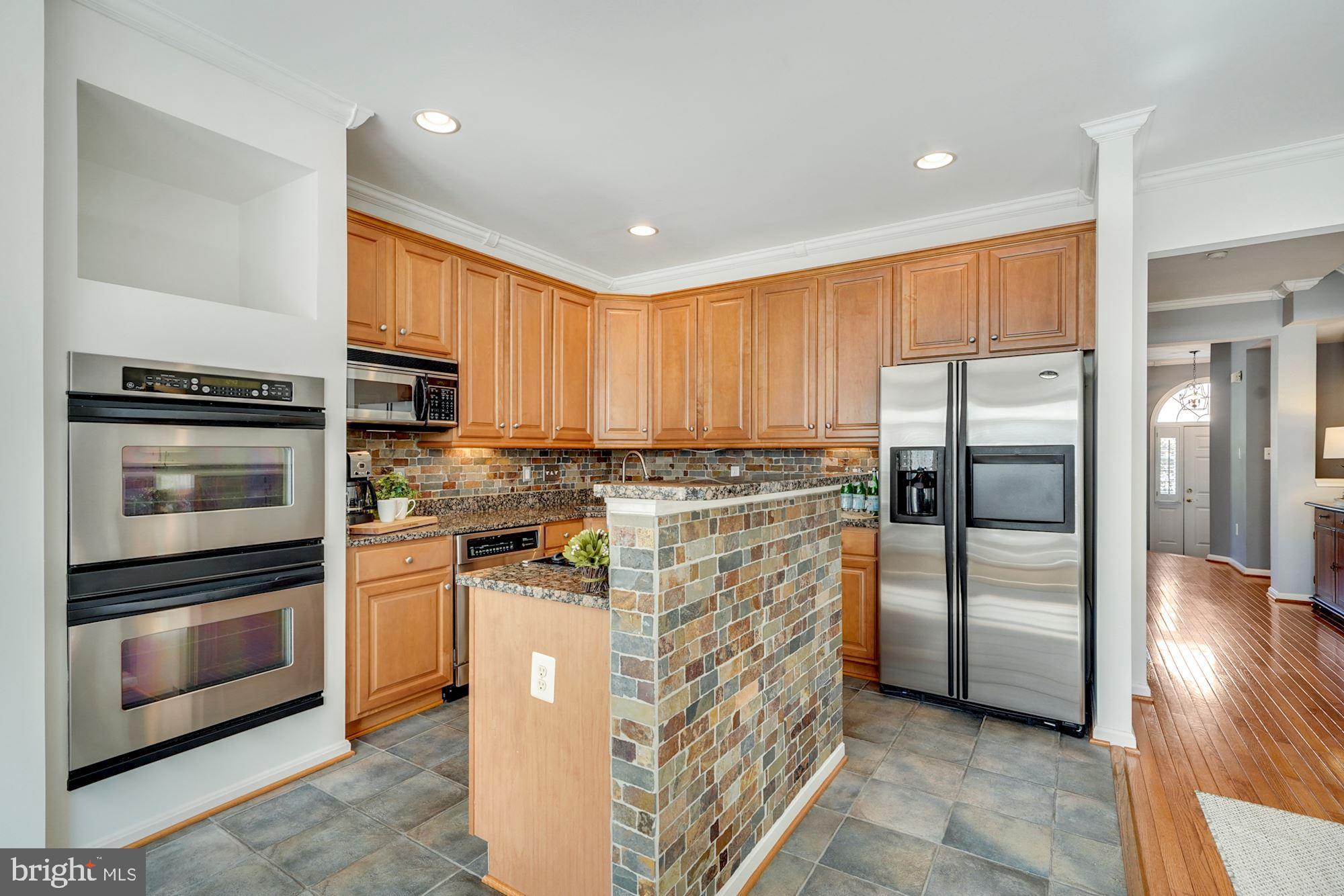 7327 Oldham Leeds Way Springfield, VA 22150 - Photo 10 of 50 Double wall ovens and gas cooktop