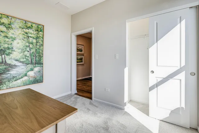 an empty room with windows and entrance