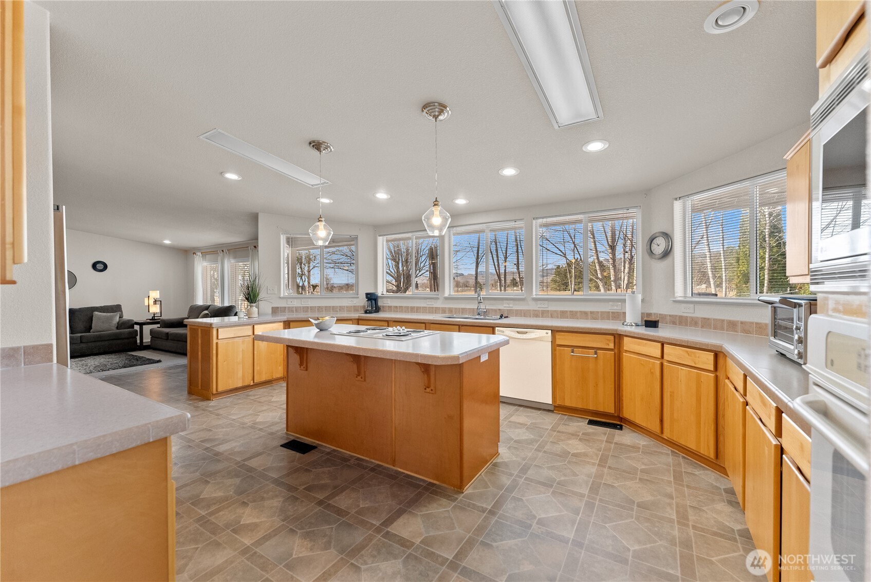 95 Woods Road Omak, WA 98841 - Photo 11 of 40 a large kitchen with stainless steel appliances lots of counter top space