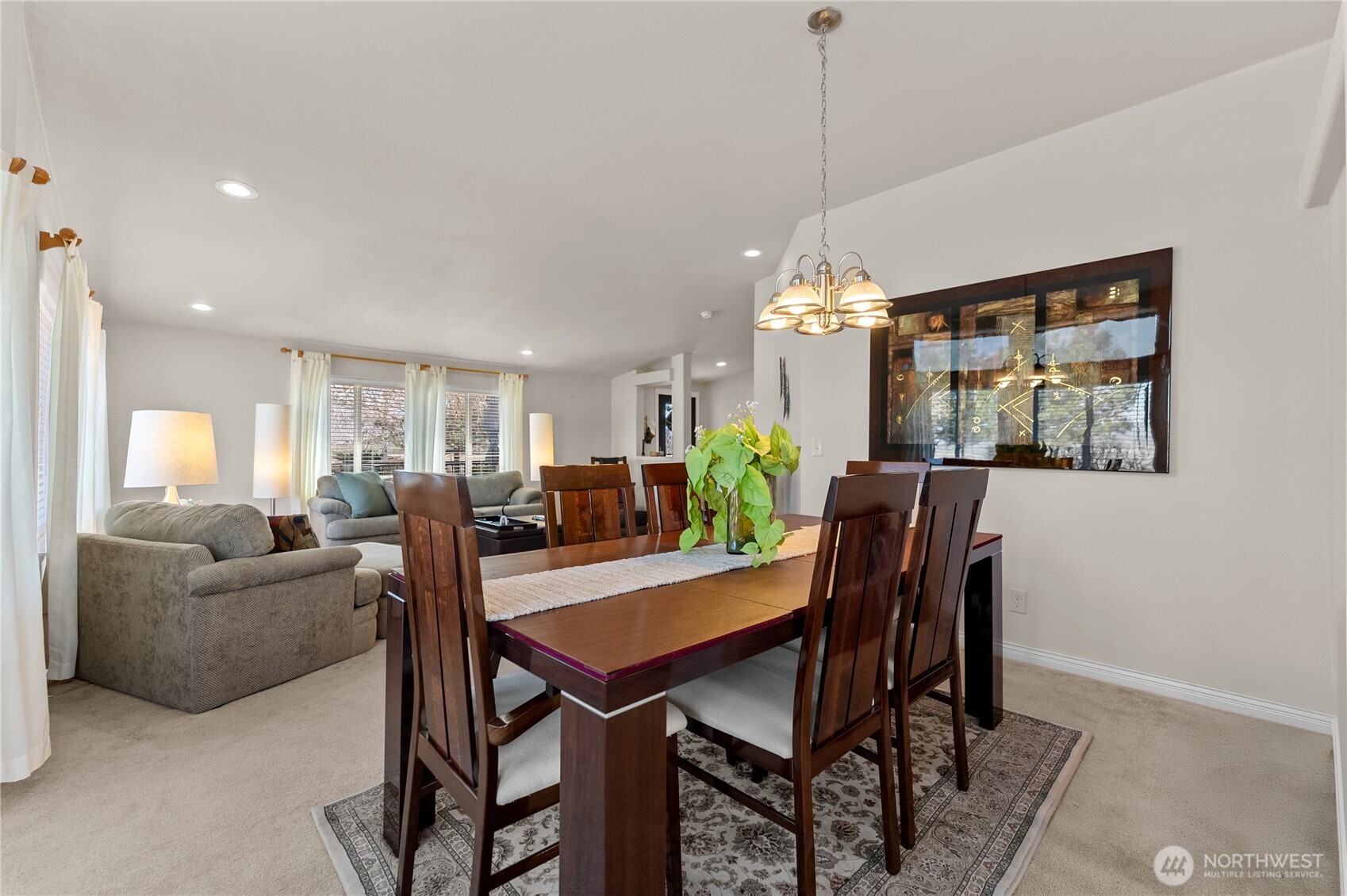 95 Woods Road Omak, WA 98841 - Photo 17 of 40 a view of a dining room with furniture window and wooden floor