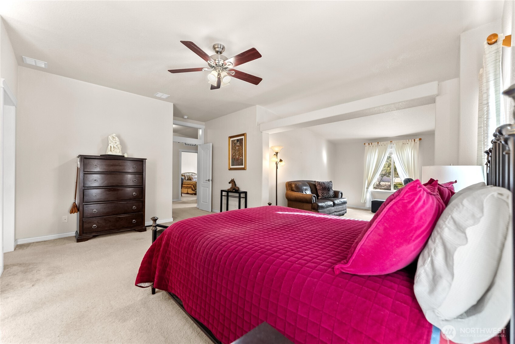 95 Woods Road Omak, WA 98841 - Photo 29 of 40 a bedroom with a bed and a chandelier