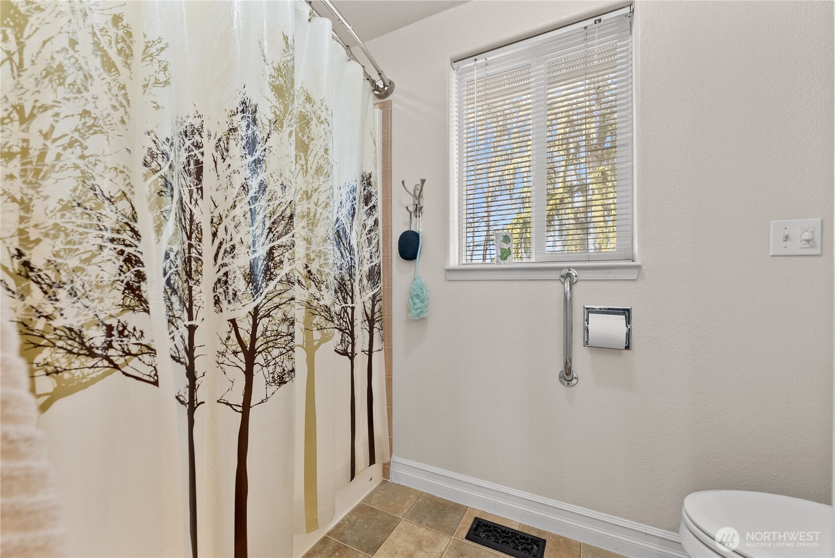 95 Woods Road Omak, WA 98841 - Photo 35 of 40 a bathroom with a toilet and shower curtain