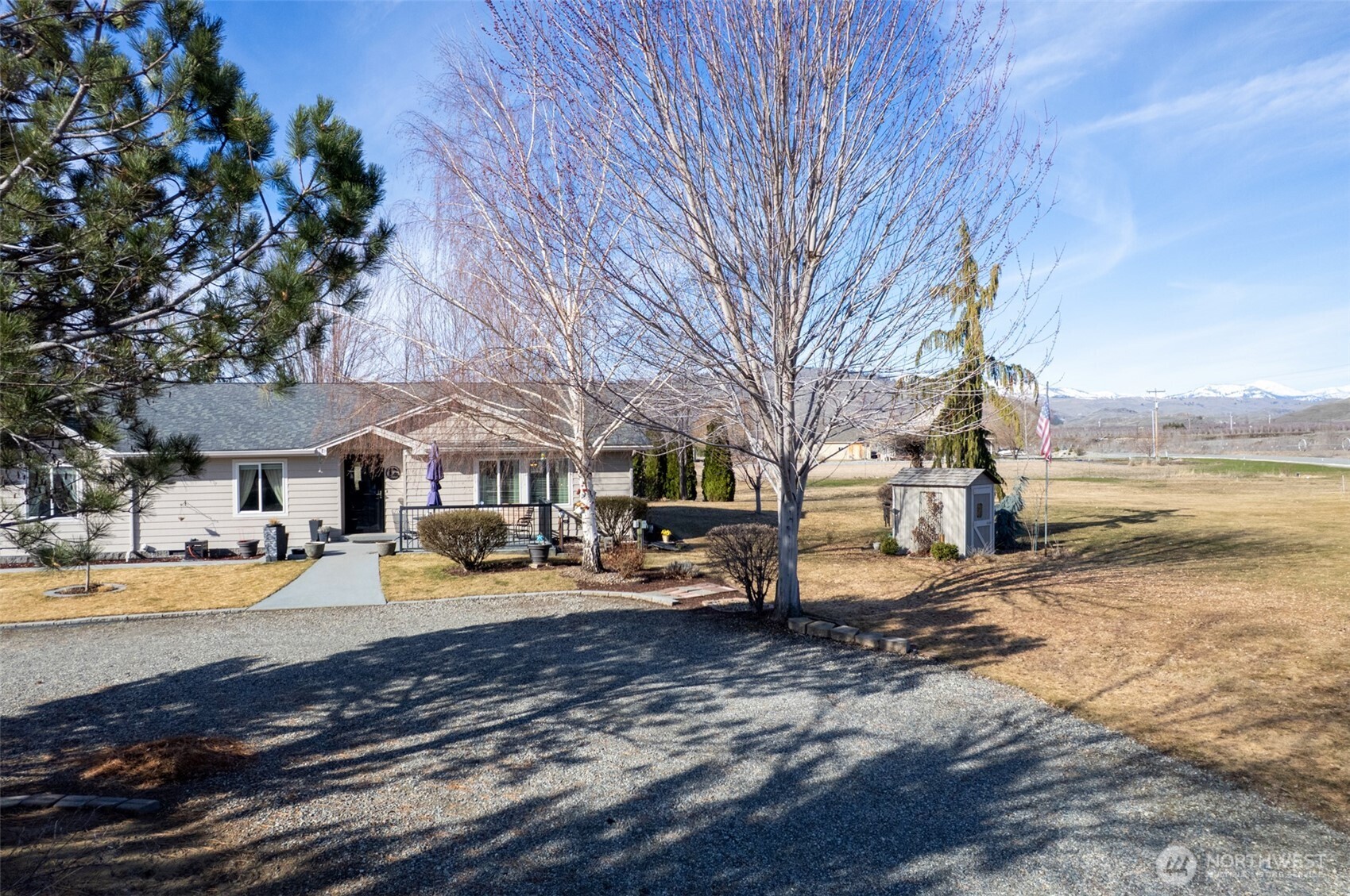 95 Woods Road Omak, WA 98841 - Photo 4 of 40 a view of a house with a yard covered in snow