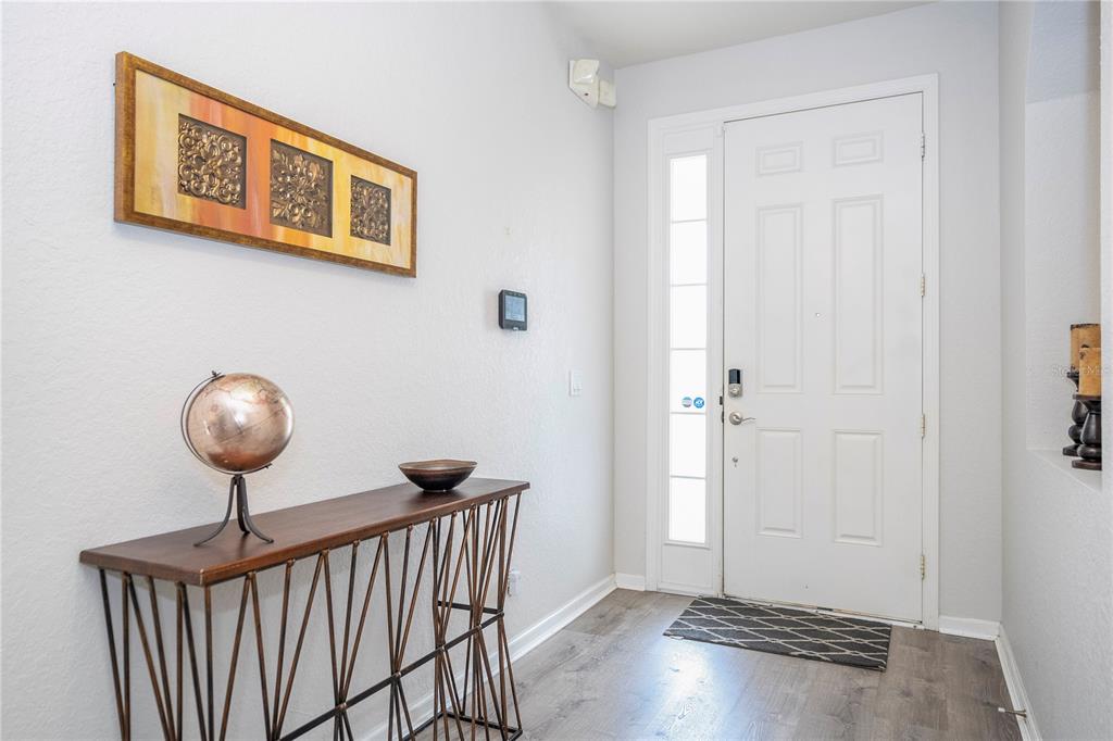4978 Strand Street Kissimmee, FL 34758 - Photo 11 of 30 a view of a hallway with wooden floor and closet