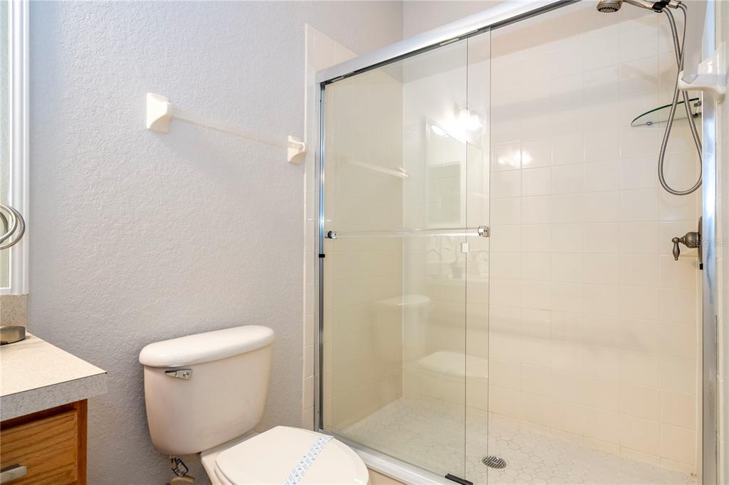4978 Strand Street Kissimmee, FL 34758 - Photo 17 of 30 a white toilet sitting next to a bathroom sink