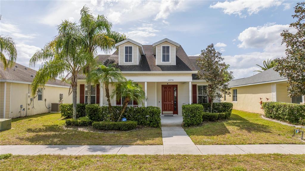 4978 Strand Street Kissimmee, FL 34758 - Photo 2 of 30 a front view of a house with garden