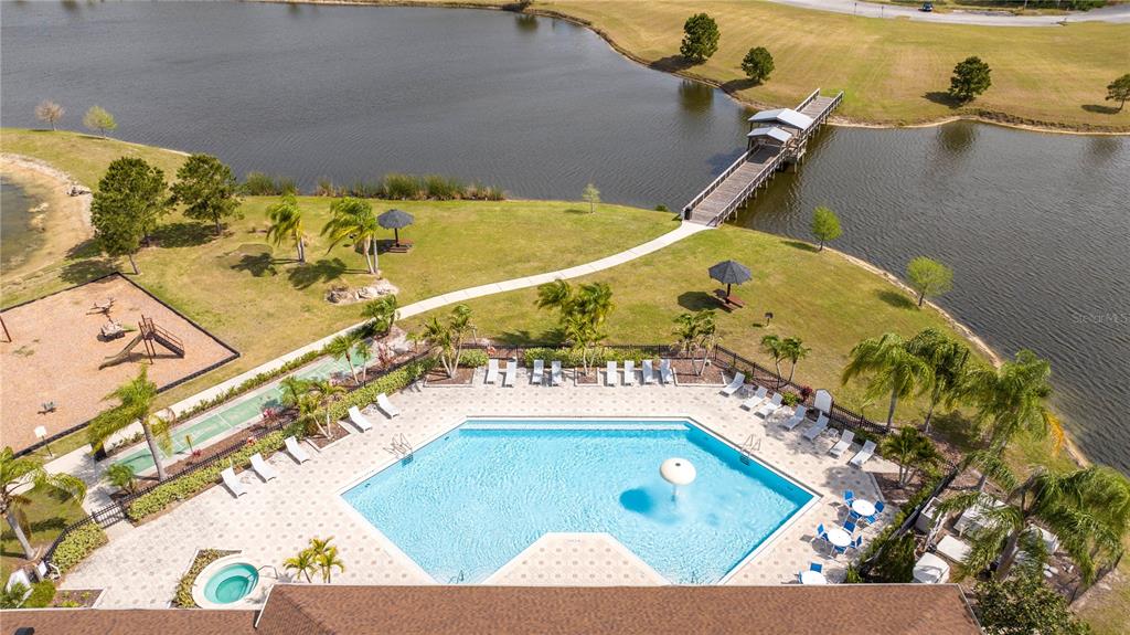 4978 Strand Street Kissimmee, FL 34758 - Photo 26 of 30 a view of a swimming pool with chairs