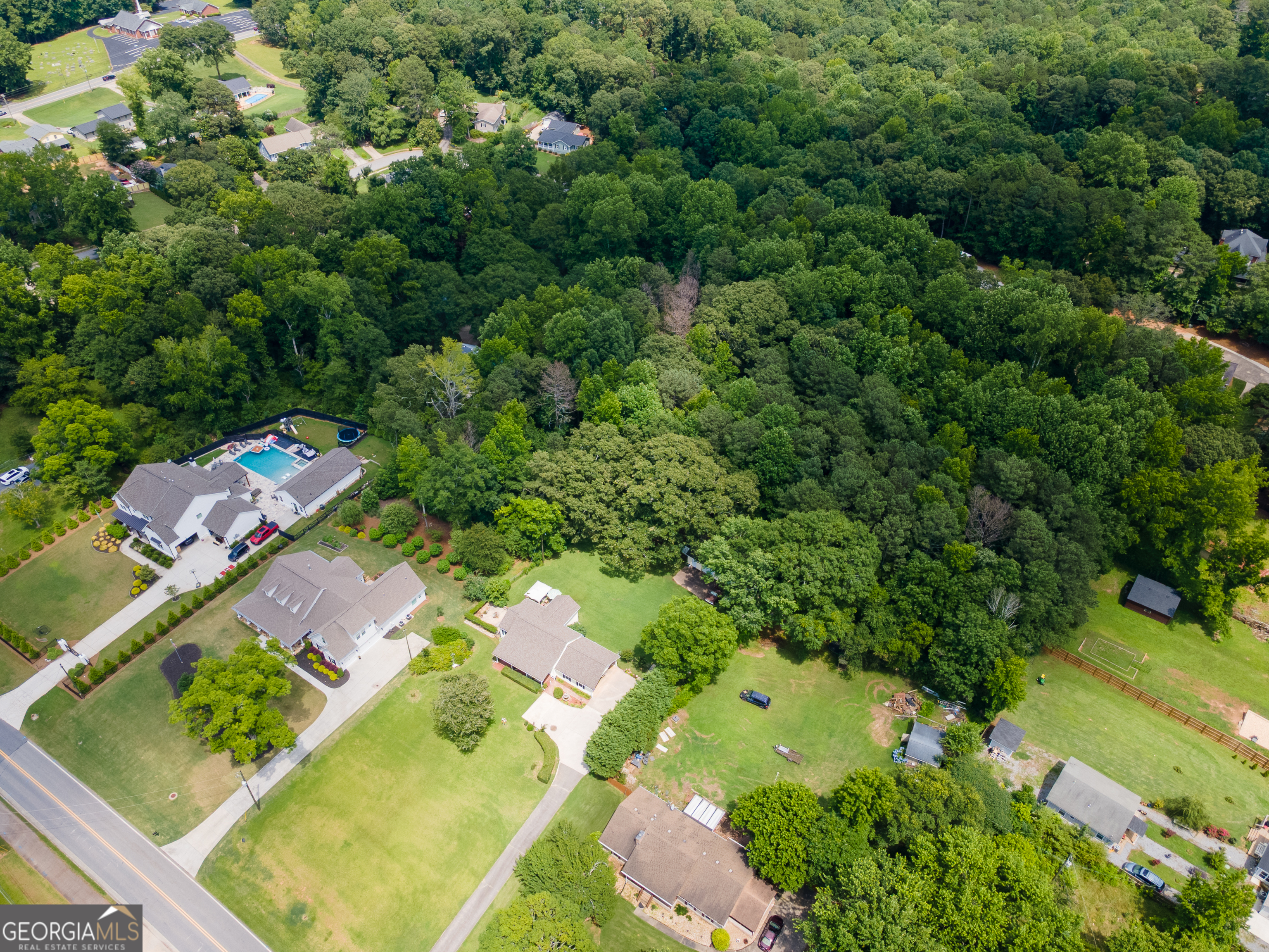 4017 South South Bogan Road Buford, GA 30519 - Photo 11 of 11 an aerial view of residential houses with outdoor space