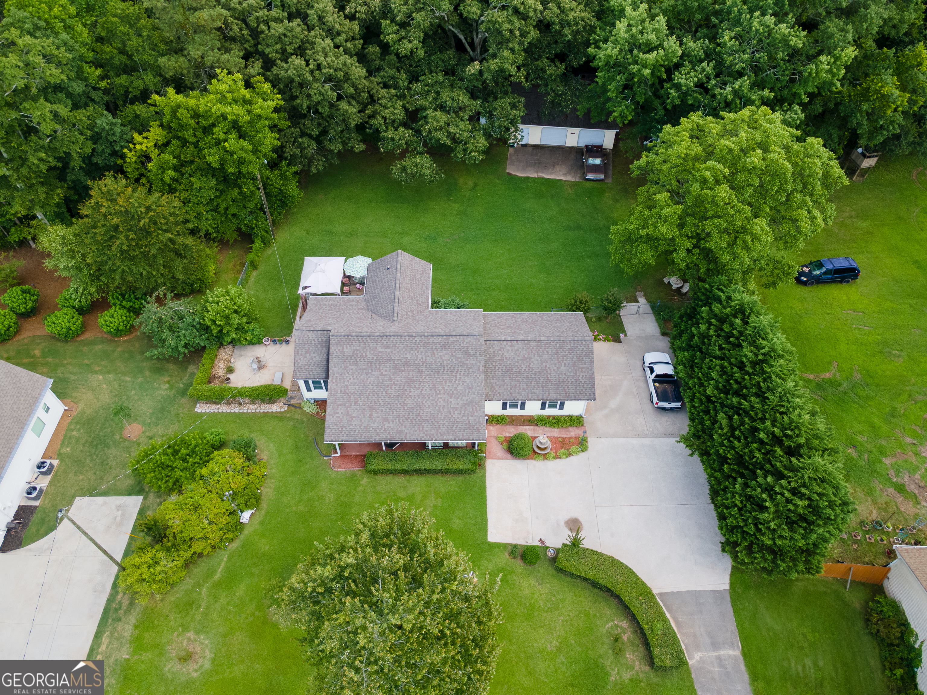 4017 South South Bogan Road Buford, GA 30519 - Photo 3 of 11 an aerial view of a house with swimming pool and garden